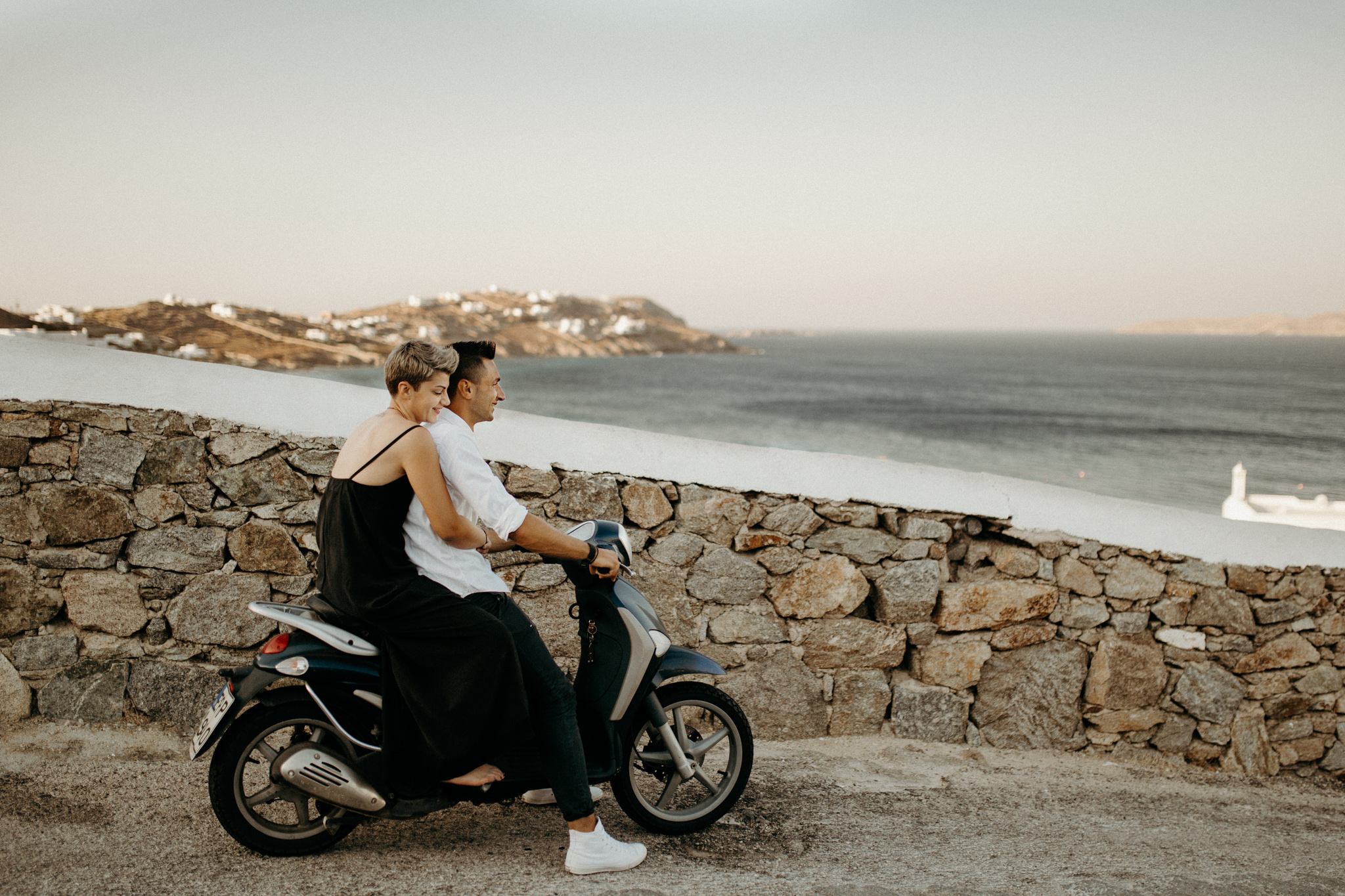 Hip & Stylish Engagement Session on the Rocky Shores of Mykonos by Destination Elopement Photographer