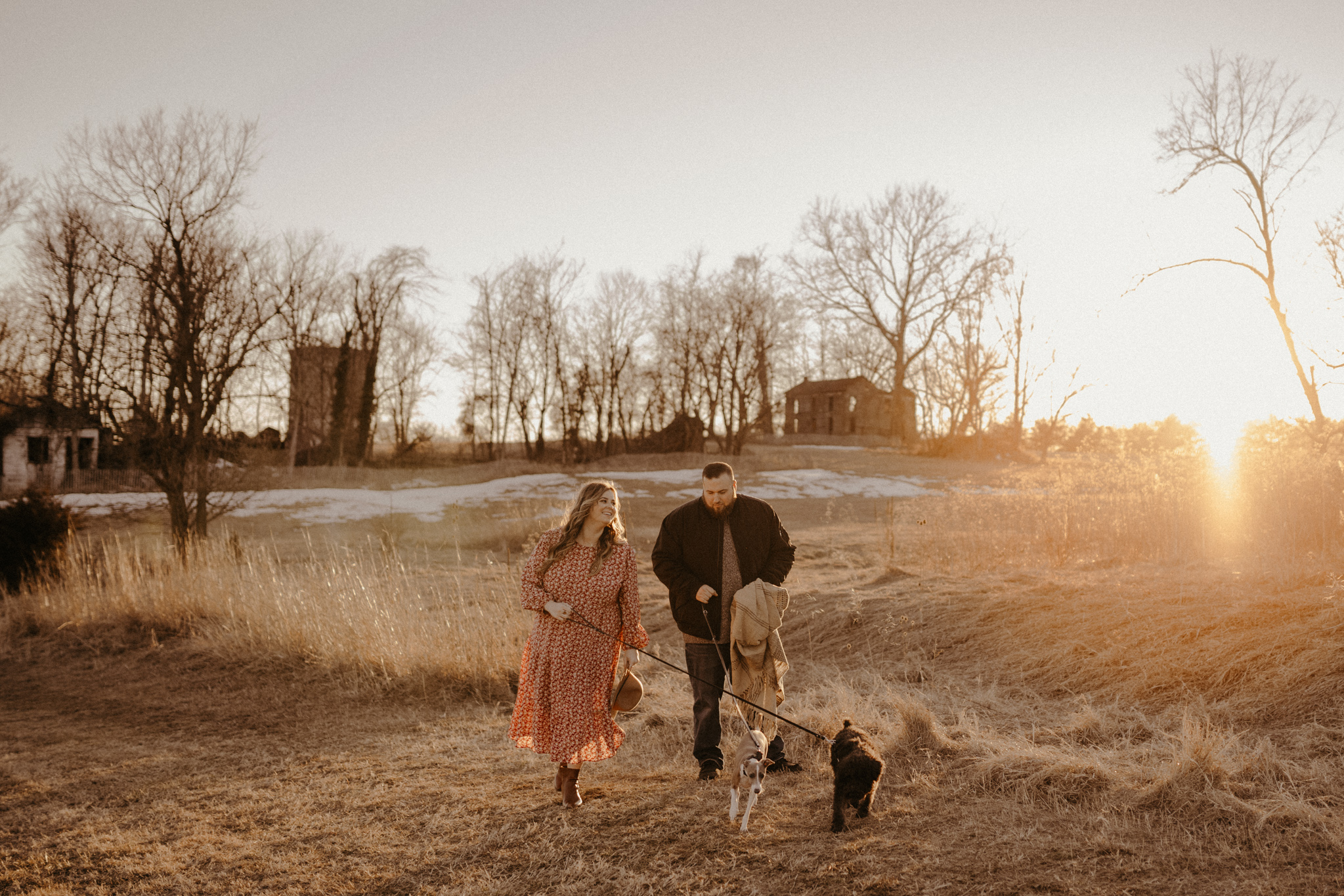 Outdoor sunny engagement session in the grassy fields of Harpers Ferry, what to wear to an engagement session, long flowy patterned maxi dress