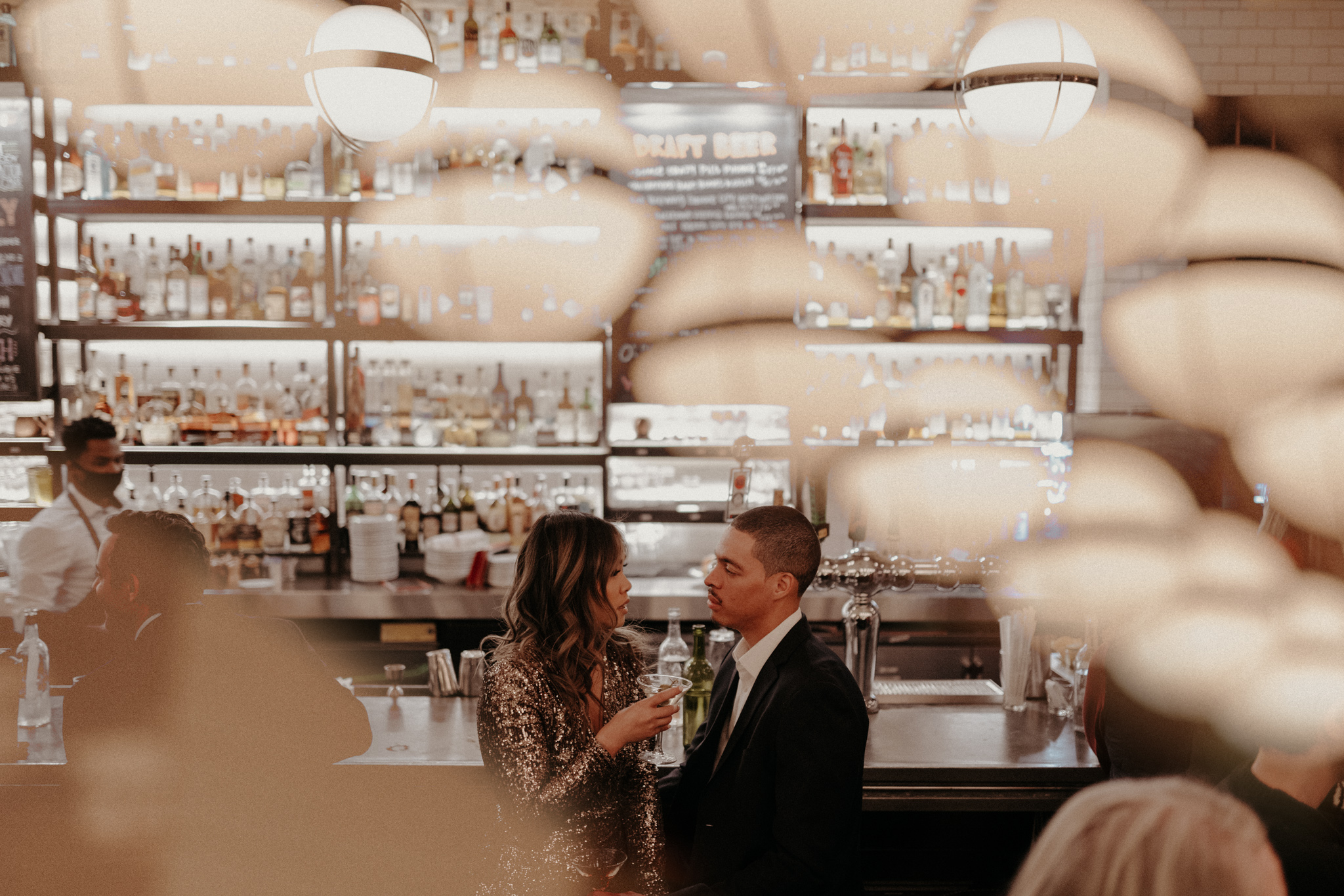Night-on-the-town engagement at a moody DC bar with gelato & cocktails by Maryland wedding photographer