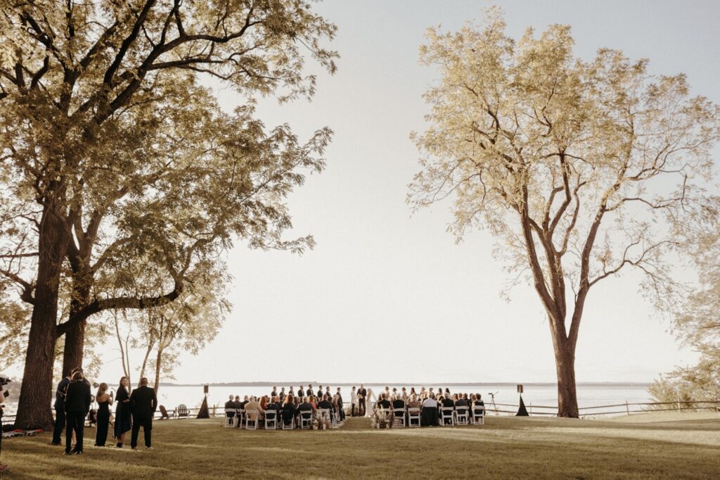 waterfront wedding ceremony with trees and a view of the chesapeake bay on the eastern shore